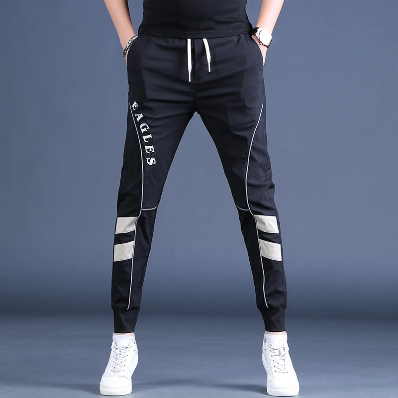 荷波撒纳温男士弹力休闲裤春秋季潮牌修身运动小脚裤冰丝黑色卫裤