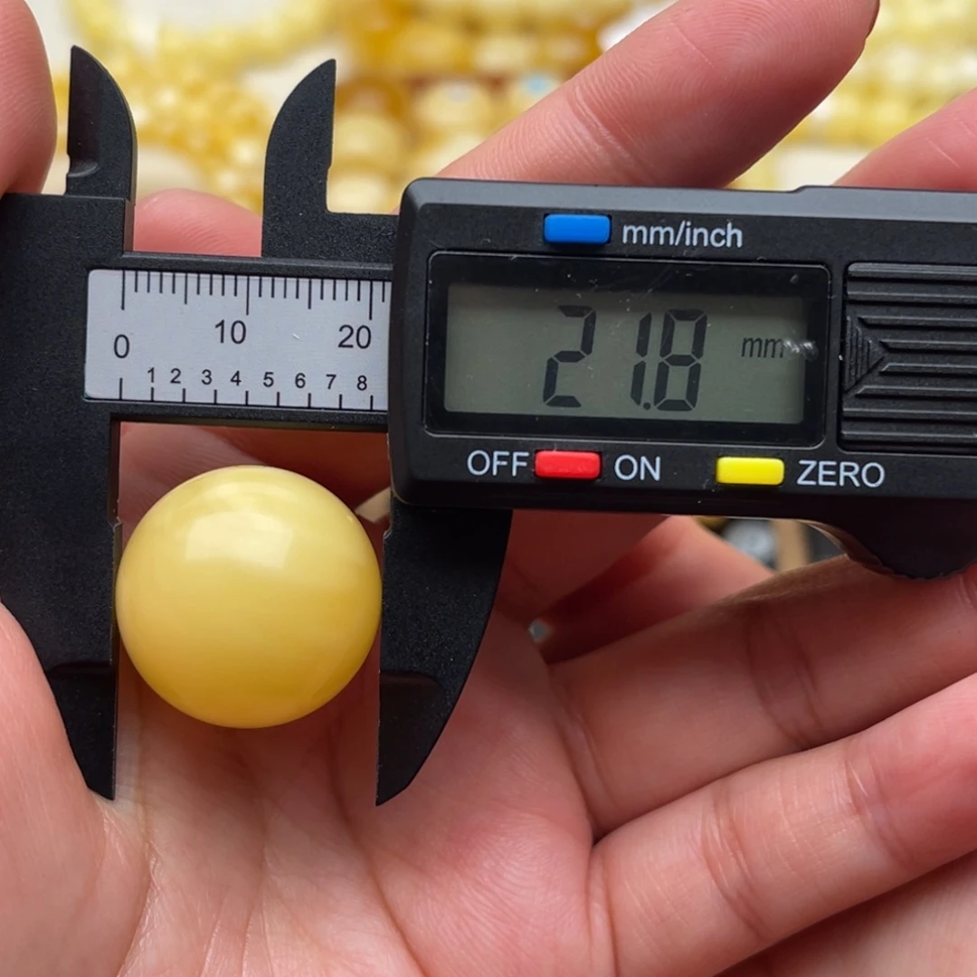 赛***车琥珀未镶嵌裸石蜜蜡圆珠笑