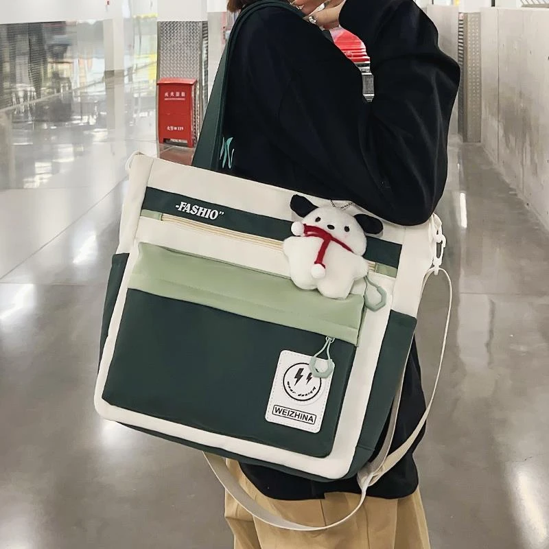 大容量学生手提包女2025新款初中生补习斜挎包高中生上课单肩包男