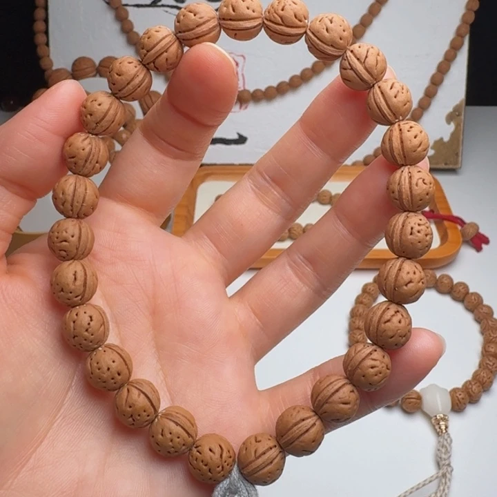 某***人手串桃核10➕一道筋手持