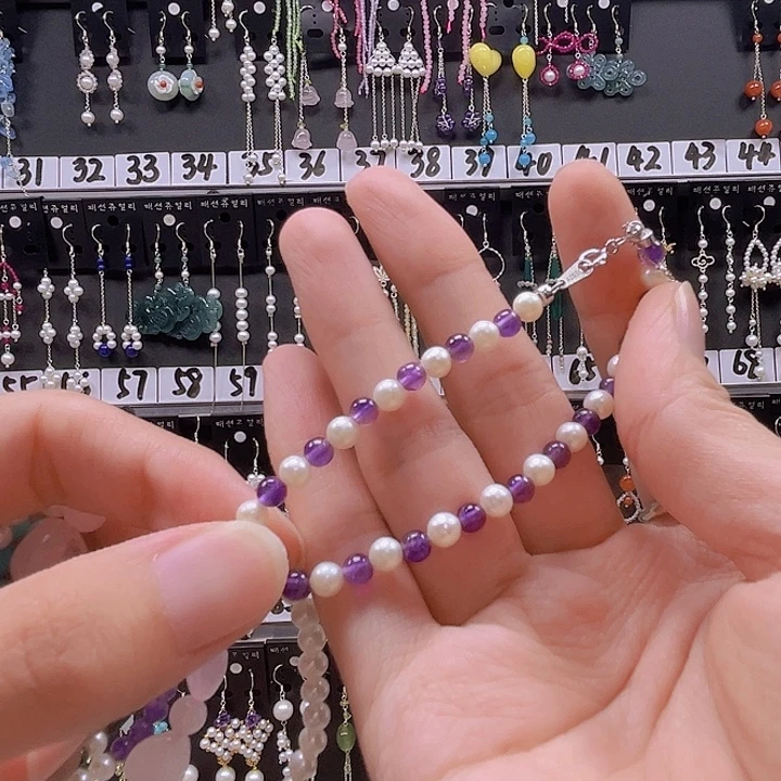 D***e银S925镶嵌耳饰淡水珍珠