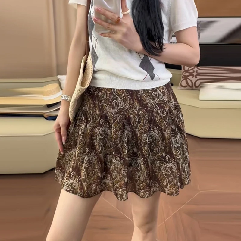 印花复古棕色出游半身裙2025夏季新款休闲风个性设计感碎花裙子潮