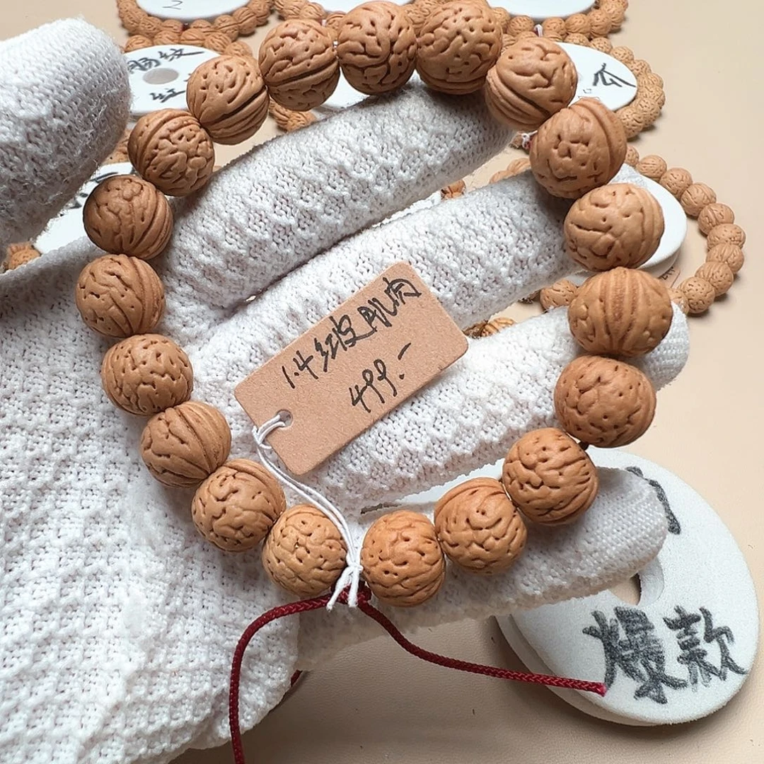 石***头桃核手串1.4红皮大肌肉精品