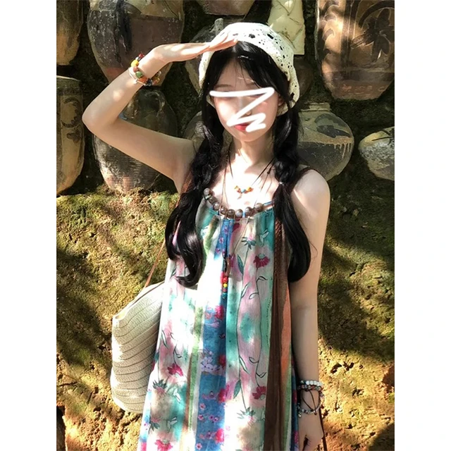 海边度假吊带连衣裙女夏2025新款法式高级感小个子碎花沙滩长裙子