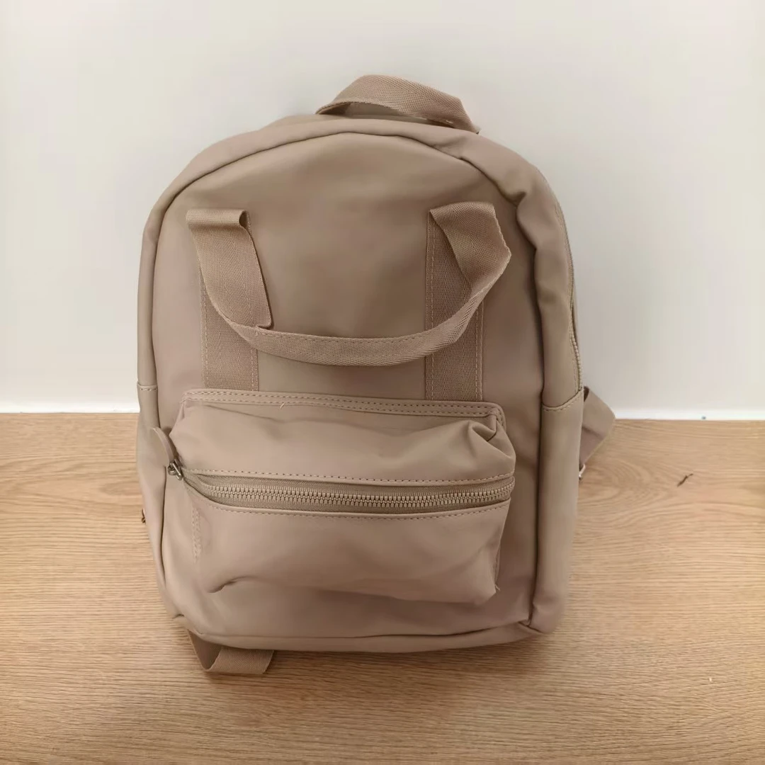 929米色小号时尚双肩包