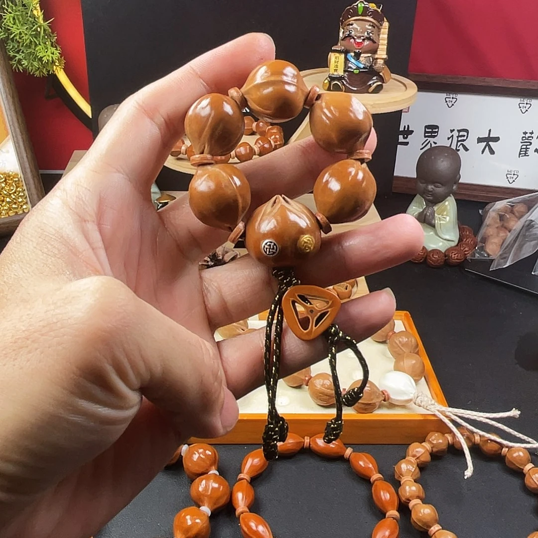 橄榄核手串梅林铁核手捻款带金银双标，一物一拍