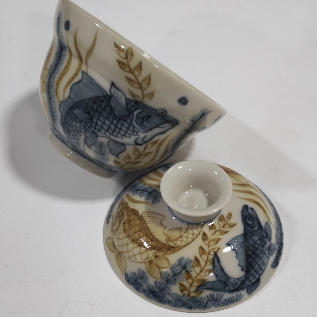 立勤堂青花釉里金蓝底九鳜布袋盖碗