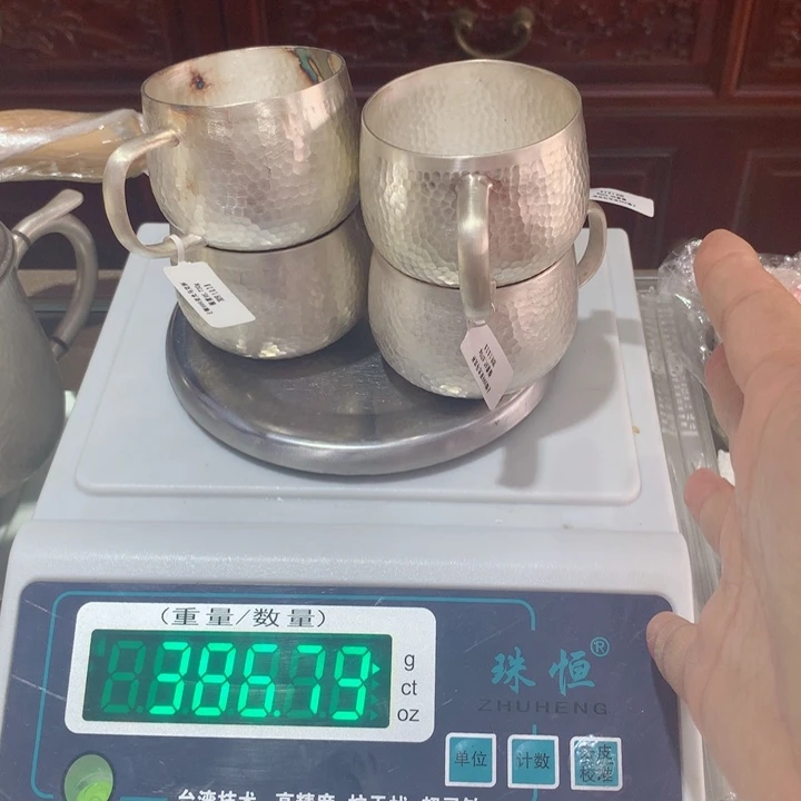 漫***河足银999锤纹茶杯4个386克