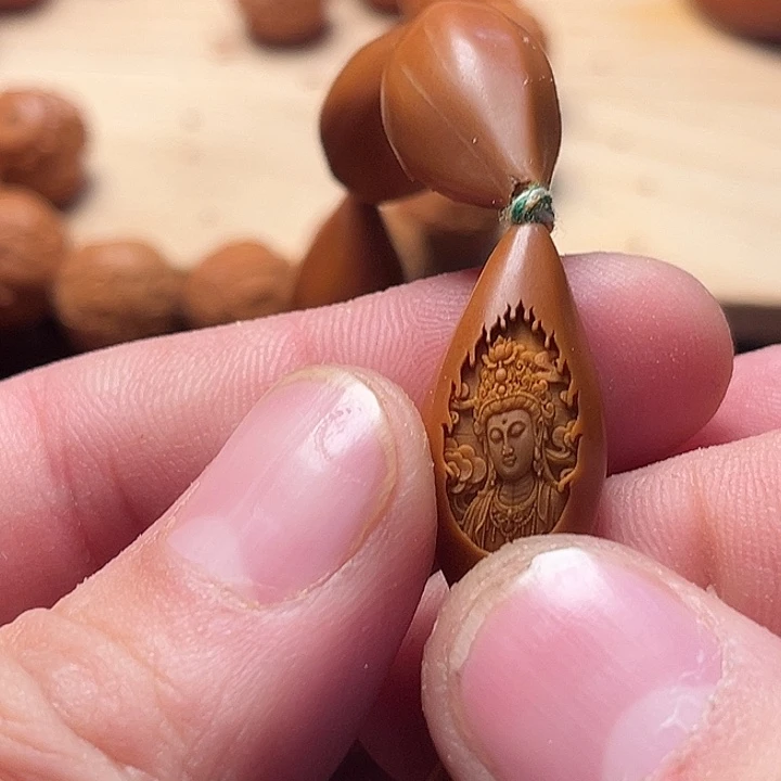 华***讯橄榄核吊坠手串观音