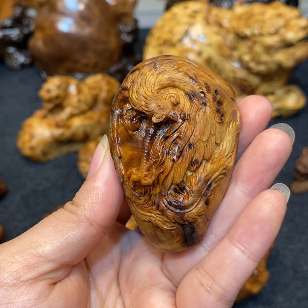 柏木（崖柏）?****?太精陈化黑金独瘤凤凰手把件