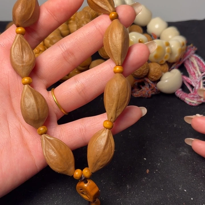 橄榄核吊坠三棱素手串