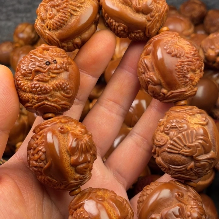 橄榄核吊坠奋***笙橄榄核手持