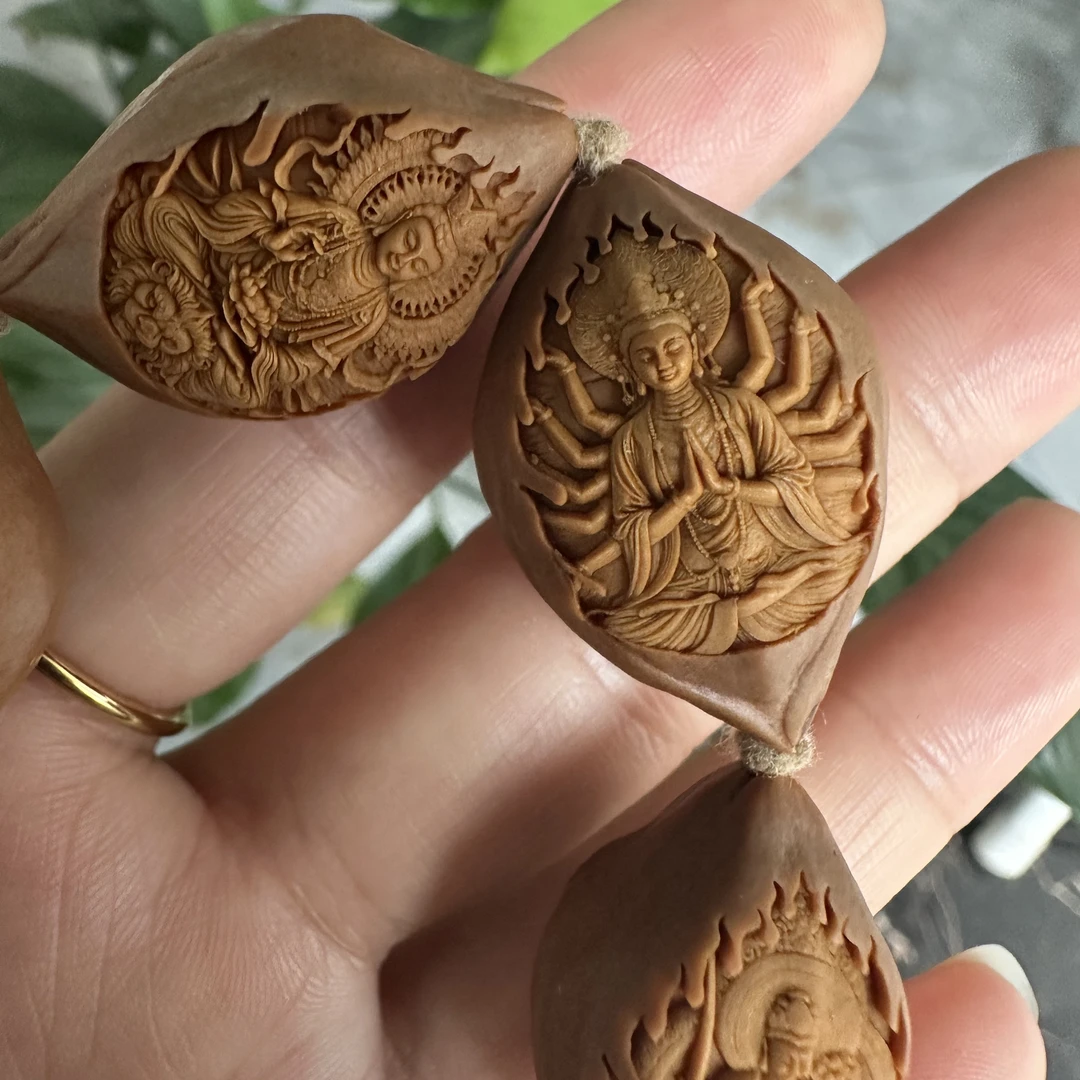 橄榄核雕包衣万佛