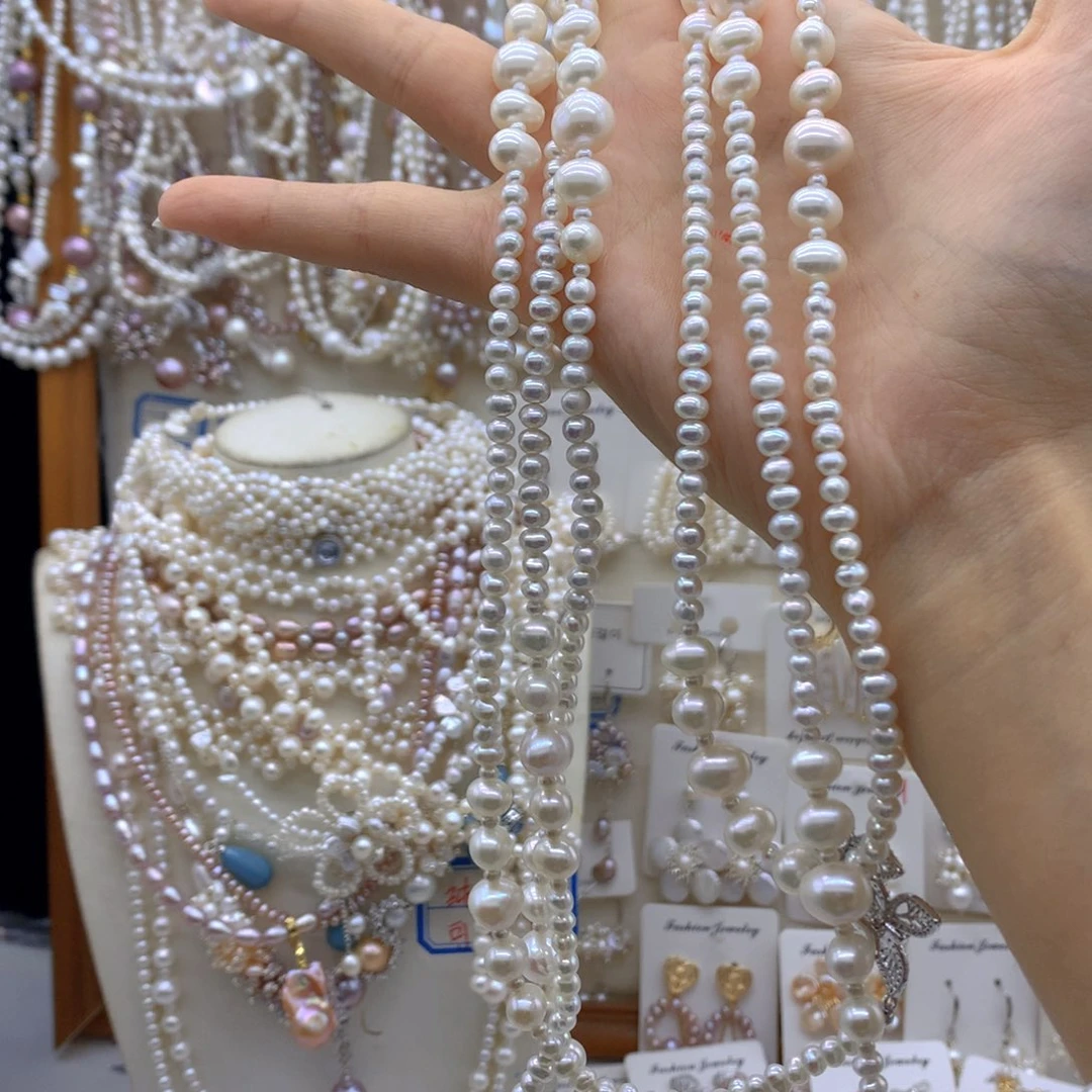 涣***然合金淡水珍珠项链耳饰