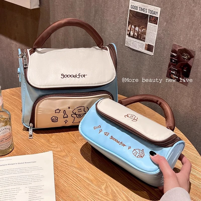 化妆包女2025新款高端大容量便携式外出手提旅行护肤品分区收纳包