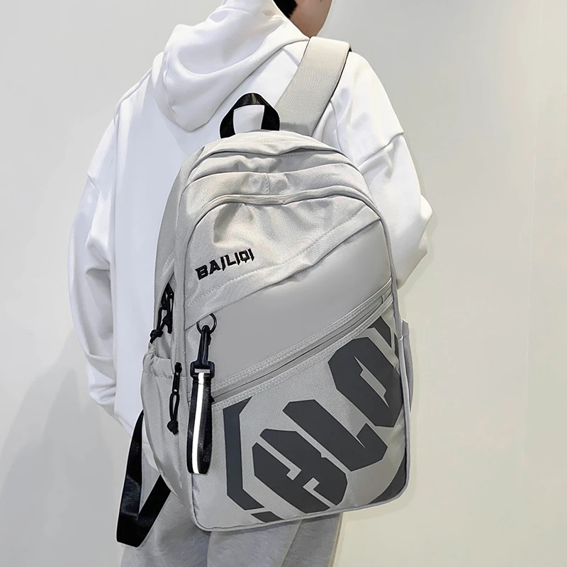 减负护脊书包男生高中生大容量双肩包初中生大学生旅行背包女肩包