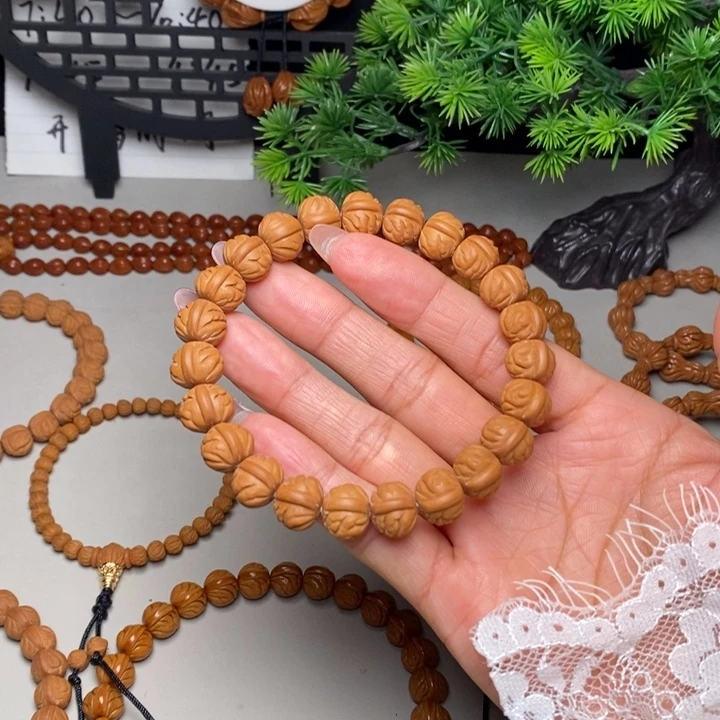 手串桃核凤羽聚宝盆