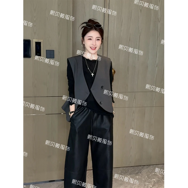 熙贝薇 欧货不规则V领斜肩早秋叠穿无袖设计感西装马甲 G5185