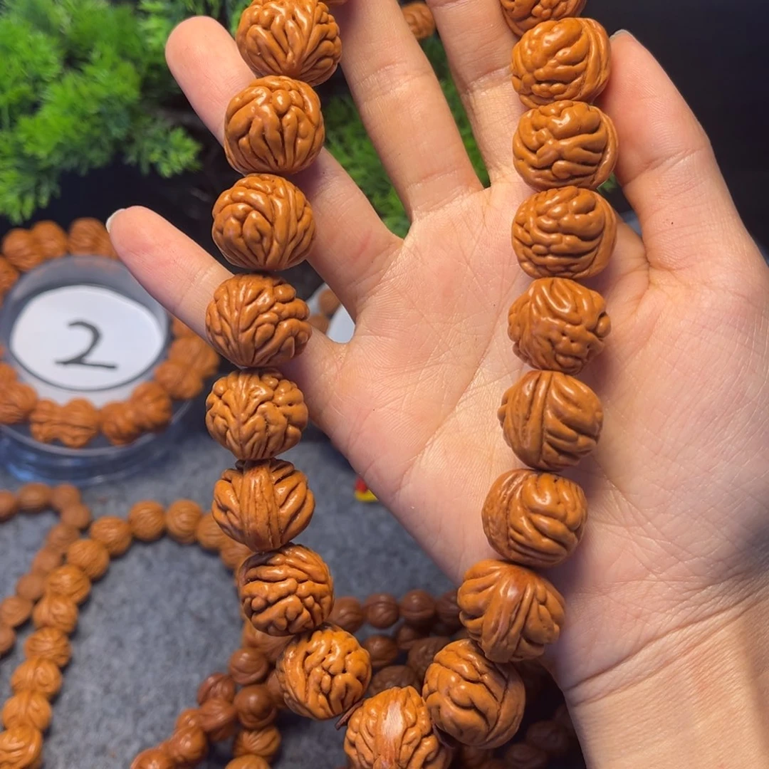 文玩核桃吊坠孙*乐桃核手持