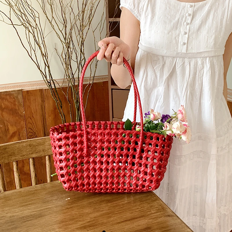 春季镂空马卡龙色编织手提菜篮子包2025新款海边度假包包包水桶包