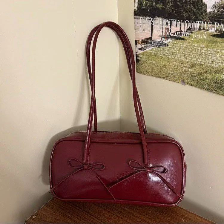 红色蝴蝶结法棍腋下包包女2025新款时尚通勤高级感包包手提单肩包