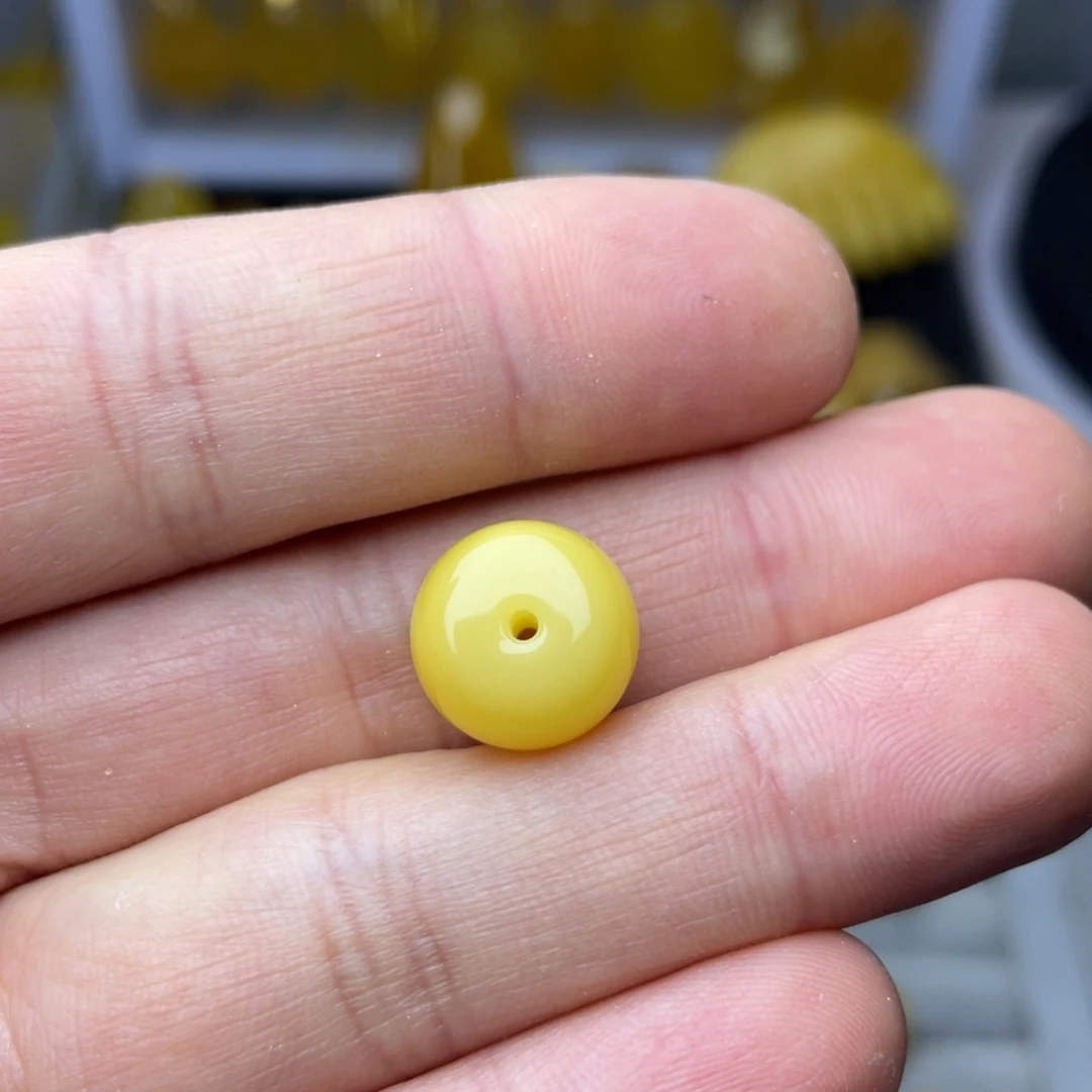 蜜蜡珠宝奇石未镶嵌长****亮老型一颗约12.8毫米