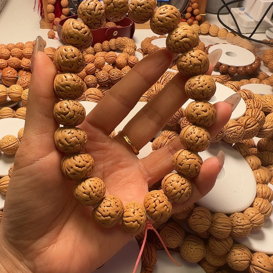 桃核吊坠树王纽扣手持