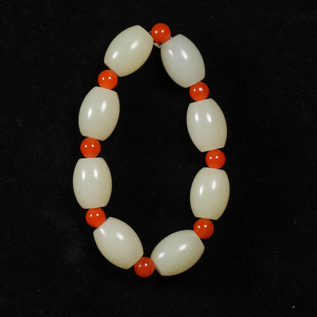 lot38新疆若羌黄口路路通手串/保利拍卖