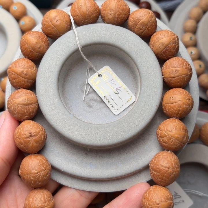 凤眼菩提吊坠15.5m m手持