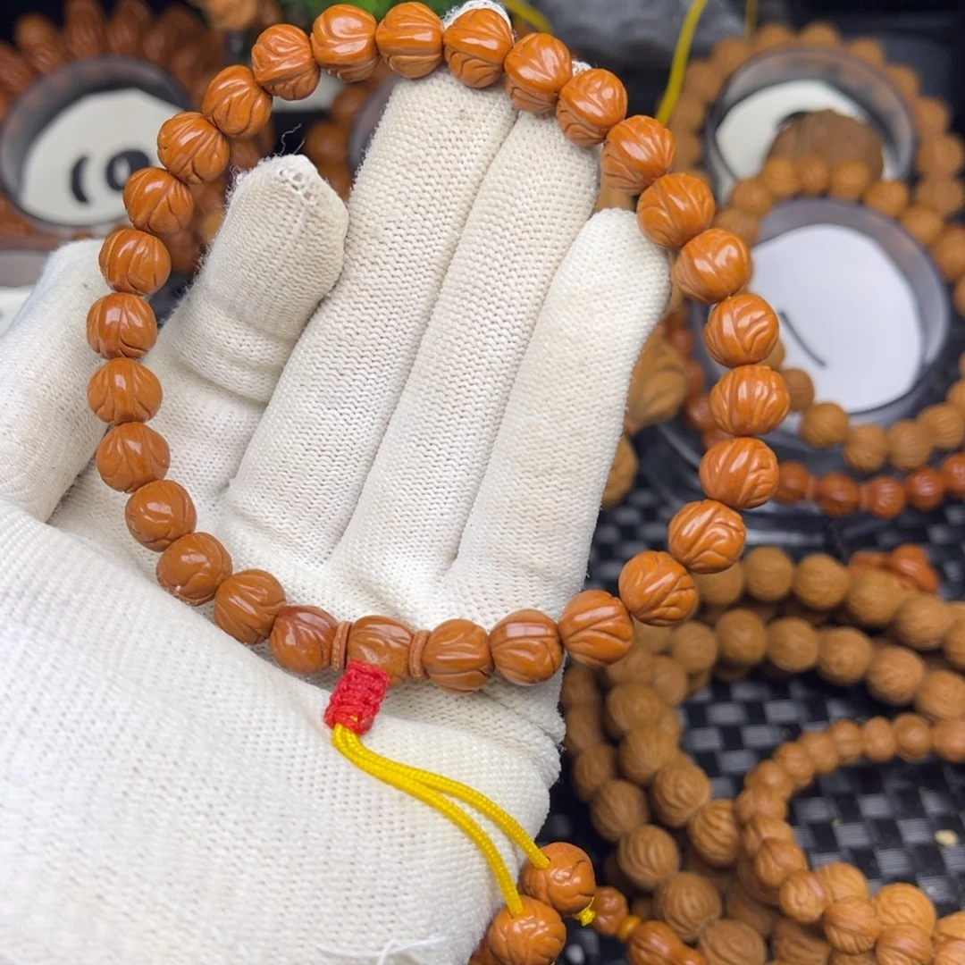 爱***己手串桃核玉龙脊单圈