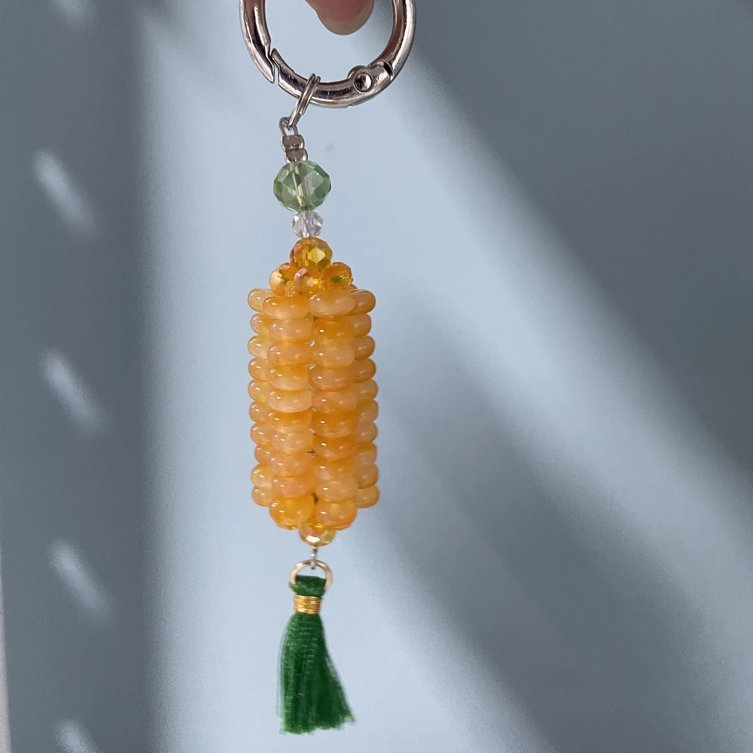 编织橘黄色玉米手机坠E886