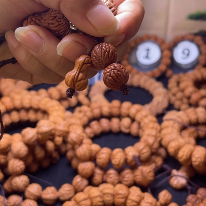 伯***牙吊坠桃核钥匙挂件