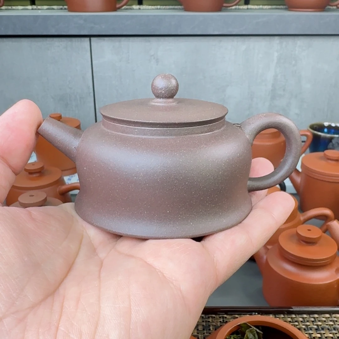 紫砂茶壶聪**忙微瑕半手曲钟