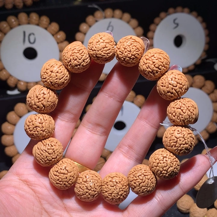 桃核手串正圆龙鳞王