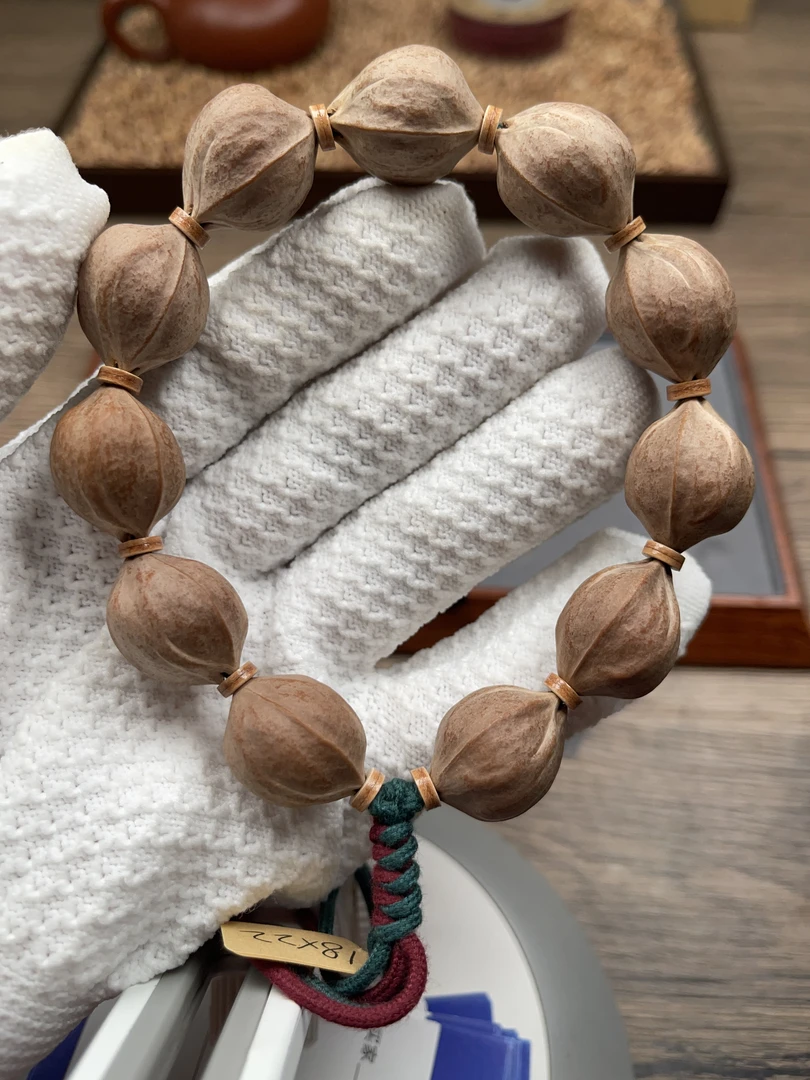 1.8*2.2尺寸广东梅林铁核橄榄核手串素串抛光去霜打底精品文玩