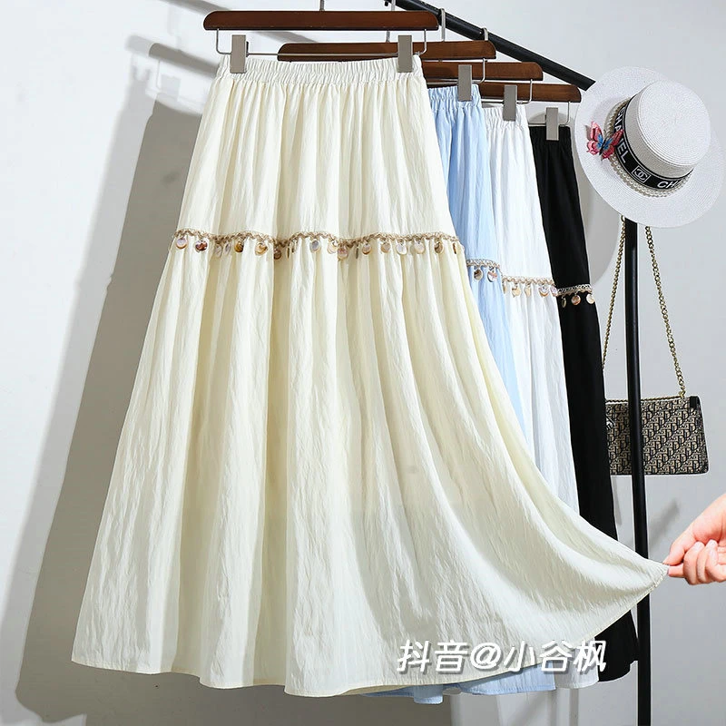 爆款波西米亚民族风流苏吊坠半身裙女款2025春秋新款大摆裙子长裙