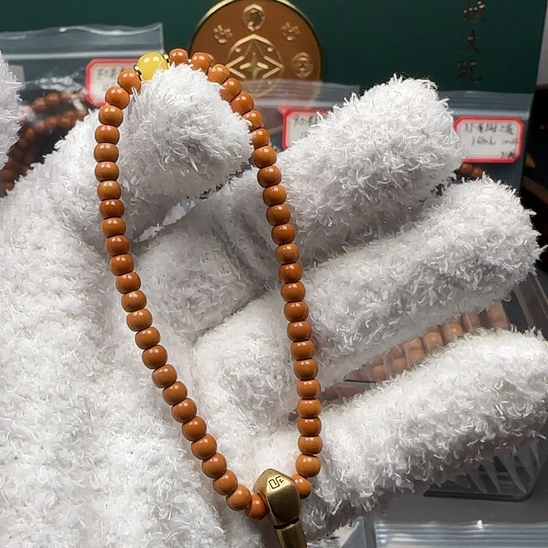 橄榄核把件4.9mm老挝红料核尖手持福利款