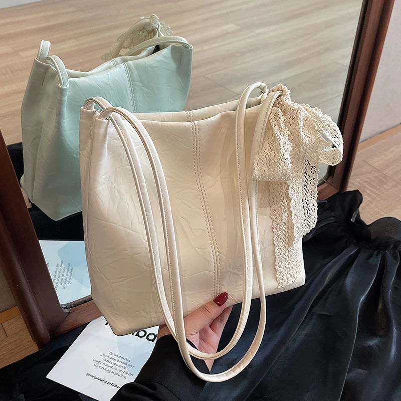 小众复古高级质感蝴蝶结搭配水桶包通勤女手提单肩时尚腋下托特包