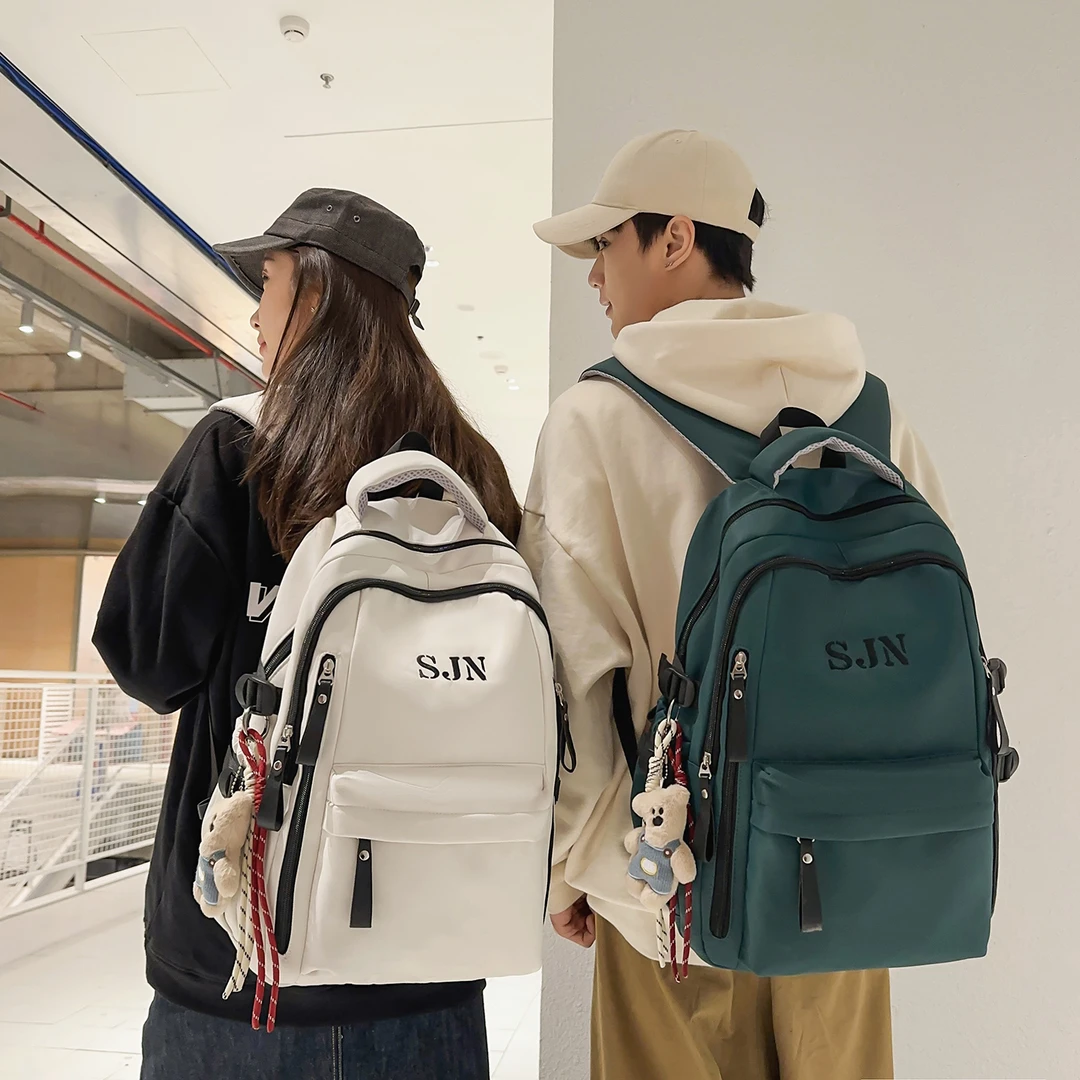 减负护脊宽背带书包初中女生高中生男款双肩包大学生旅行户外背包