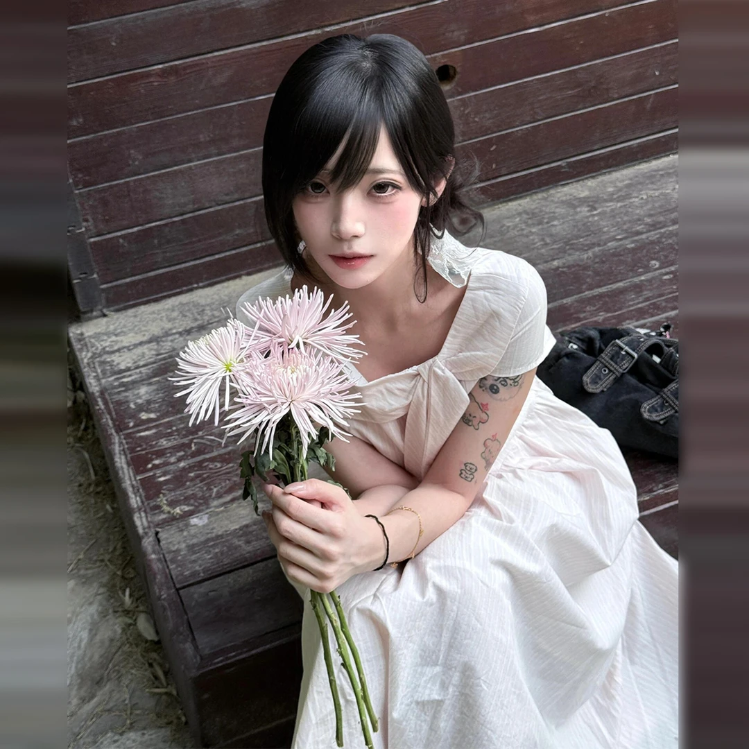 粉色蝴蝶结条纹连衣裙子女夏季2025新款法式气质学院风收腰长裙