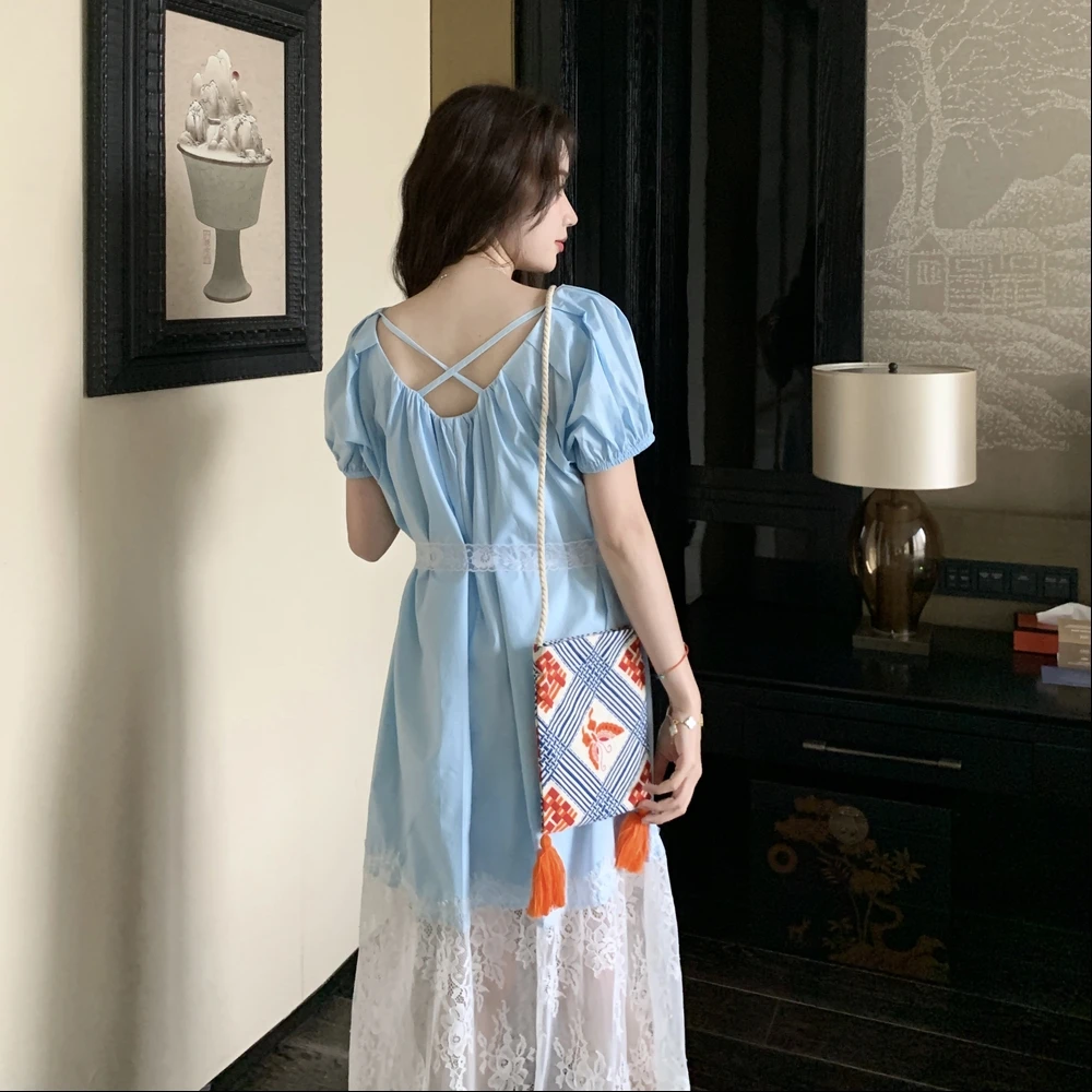 蓝色蕾丝拼接假两件连衣裙女2025夏季新款设计感露背温柔气质长裙