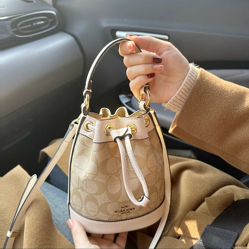 上海仓撤柜正品2025新真皮手提水桶包大神推荐时尚达人好物女包