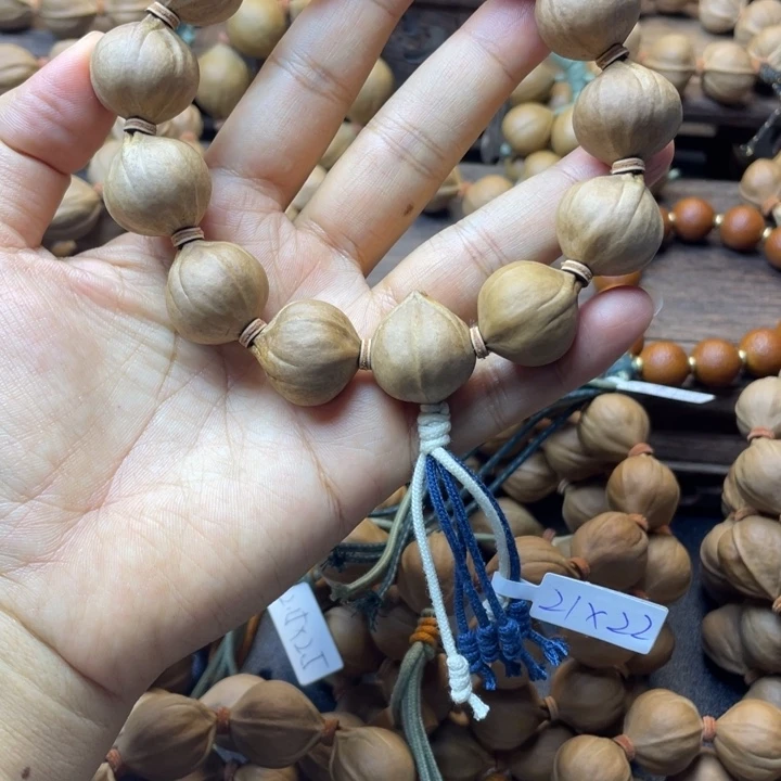 苏***_橄榄核手串/手链001-21.22