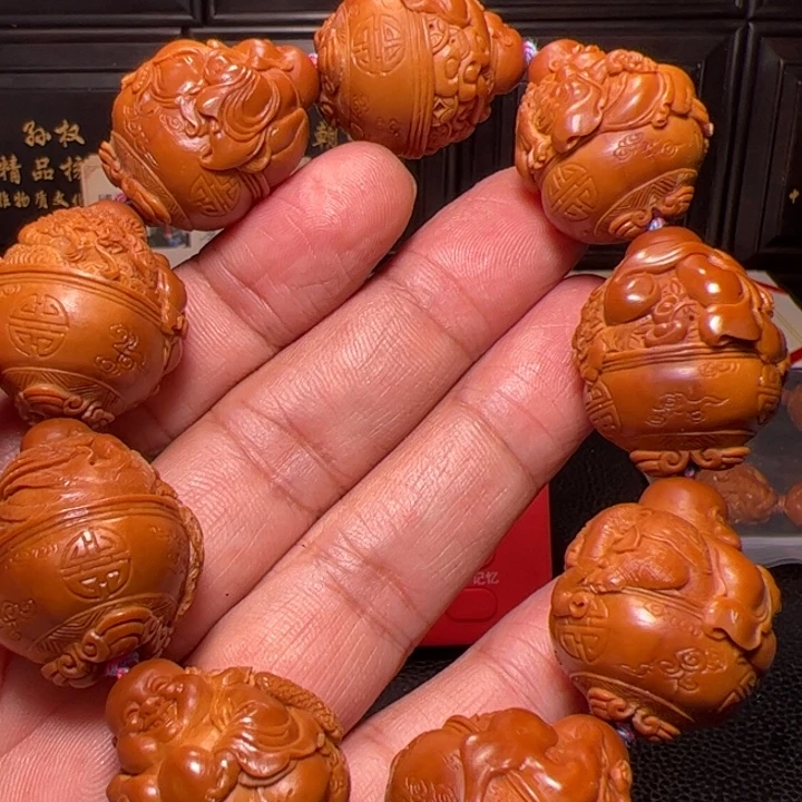 骑***士橄榄核手串聚宝弥勒