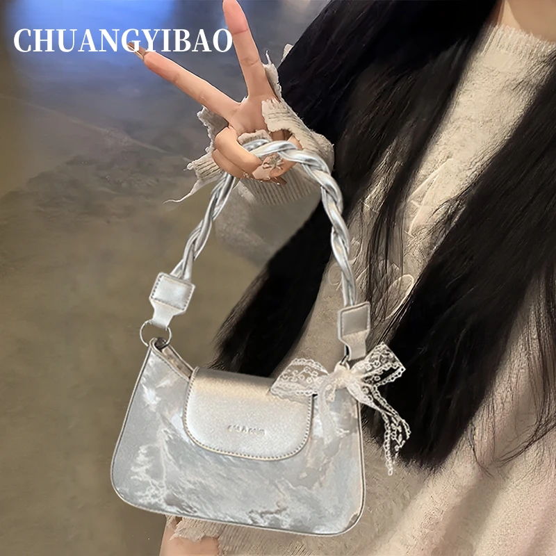 秋冬银色手提包包女式2025设计师款同款轻奢小众高级感腋下月牙包