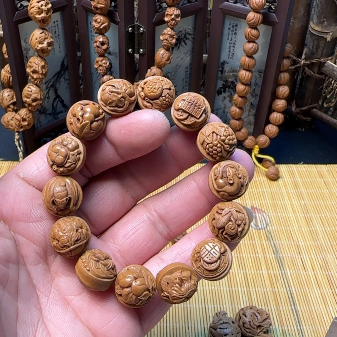 纯手工雕刻龙纹桃核多宝手串