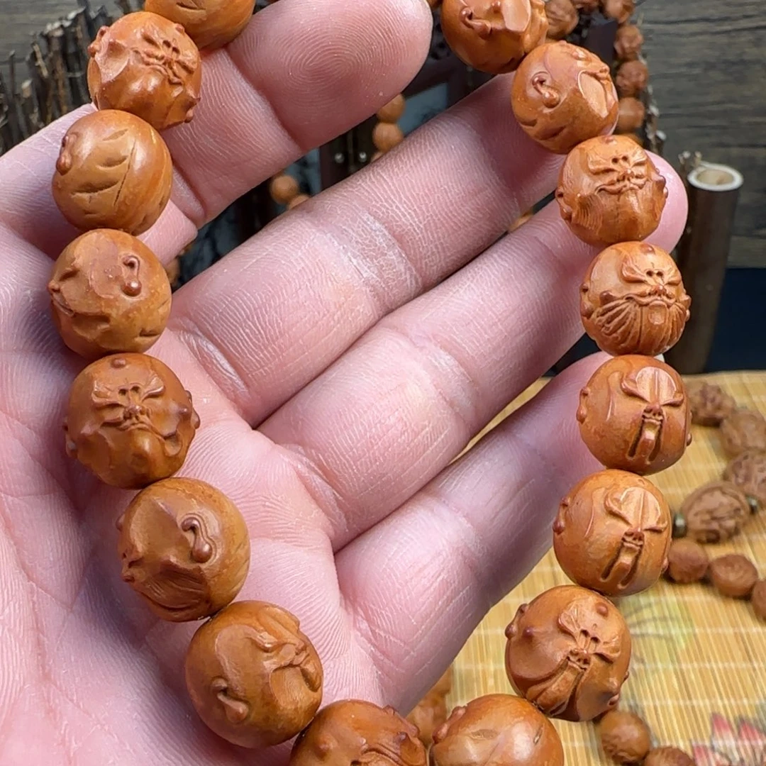 龙***雲精工雕刻龙纹桃核脸谱十八罗汉一物一图