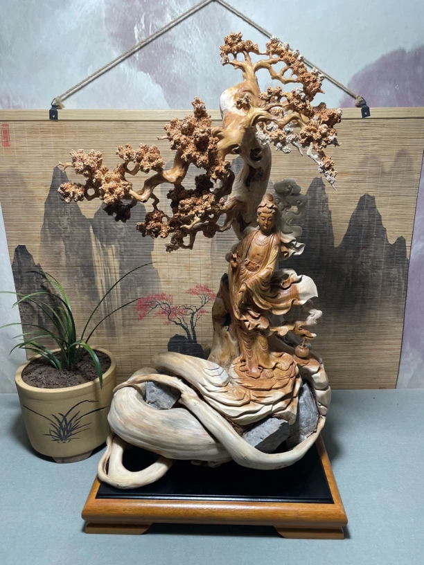 名称：观世音 材质：崖柏根包石 尺寸：高75宽41长45