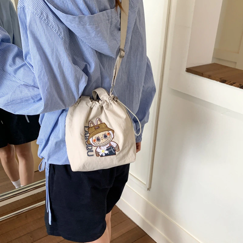 爆款拉布布斜挎小包包女新款卡通帆布水桶包通勤手机女士女款包