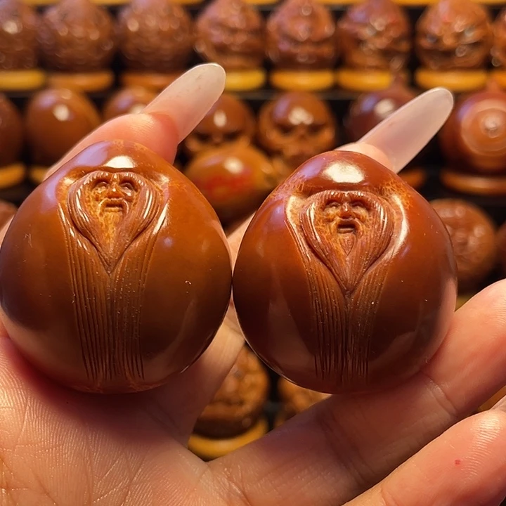 旻***浩橄榄核把件橄榄雕刻